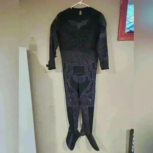 The dark knight Batman costume kids size large may fit XL